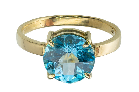 Bague en or jaune et topaze bleu
