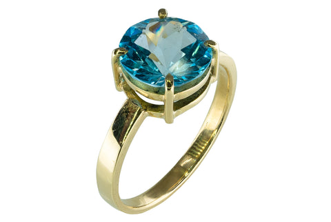 Bague en or jaune et topaze bleu