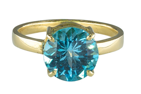 Bague en or jaune et topaze bleu